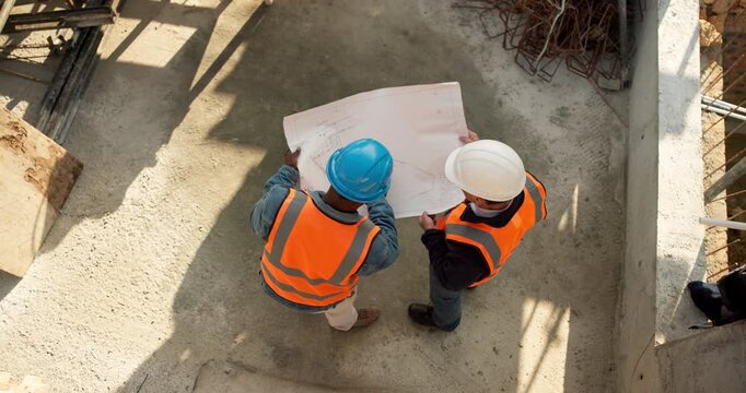 People, engineer and blueprint at site for construction, planning and safety check for architecture. Above, team or reading floor plan for design, quality control and progress of building development