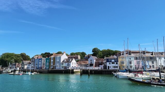 Weymouth Dorset England UK.  02.07.2026. Video. Colourful waterfront town with boats and a speed boat tour on a sunny day