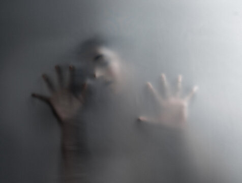 Fabric, hands and person in studio with mental health, crisis and anxiety, fear and claustrophobia with mockup. Screen, fingers and trapped figure with mind, trauma or psychology, art and nightmare