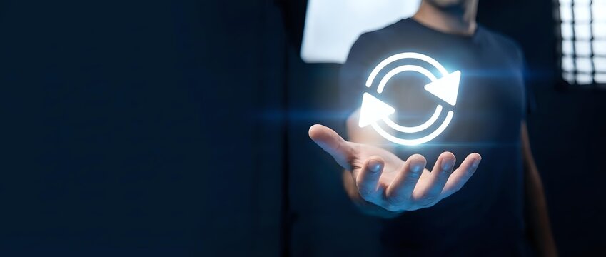 Man in dark shirt holding glowing refresh icon, symbolizing system update, data synchronization, and digital technology innovation for web and software applications.