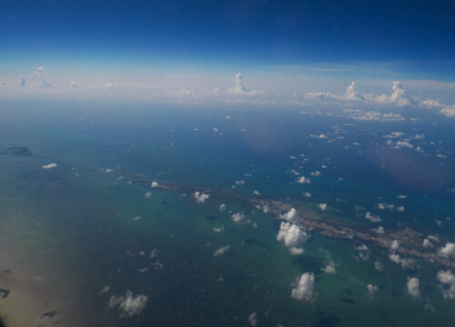 Subtropical Archipelago: High-Altitude Aerial View of the Florida Keys and Oversea Highway from an Airplane Window