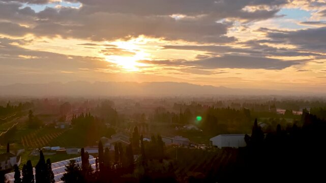 Drone flying towards sunrise over the Provence countryside, France