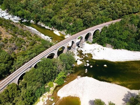 Aerial View of Historic Railway Bridge Crossing the Gardon River in Anduze, France