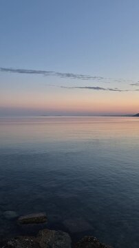 Albania Orikum showcases its stunning coastline during a peaceful sunset. The vivid colors wash over the calm waters, creating a picturesque scene for travelers seeking relaxation and natural beauty.