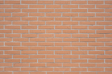 Building orange brick wall with urban textured pattern © DavidIgSu