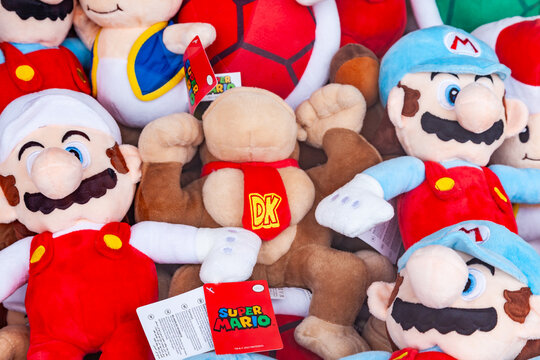 Frankfurt, Germany - May 15, 2026: Plush toys of Donkey Kong Ice Mario Fire Mario and Toad from Nintendo gaming series at a fairground stall