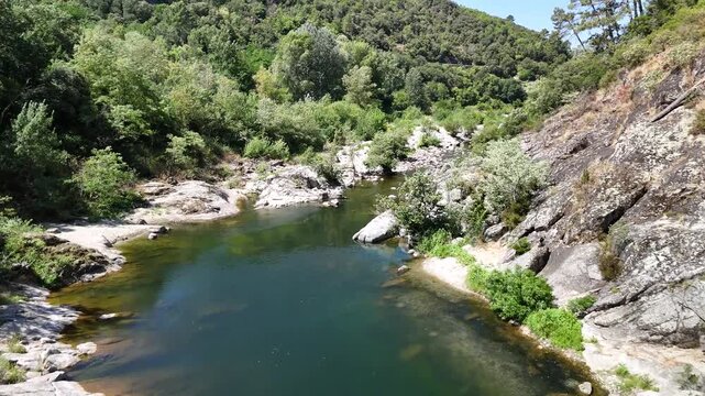 Scenic Rocky River Flowing Through the Lush Landscape of Anduze, France