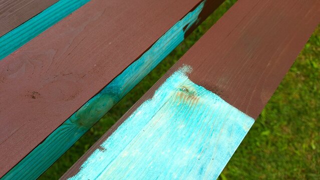 Wooden surface being coated with protective paint