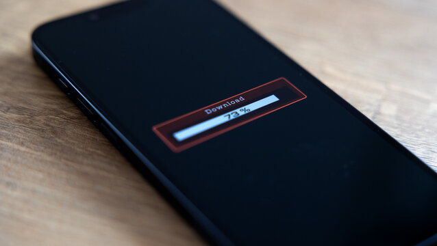 Smart phone screen shows download progress bar, downloading data, software or information. Wireless technology, internet download, status, mobile device, digital asset management, business.