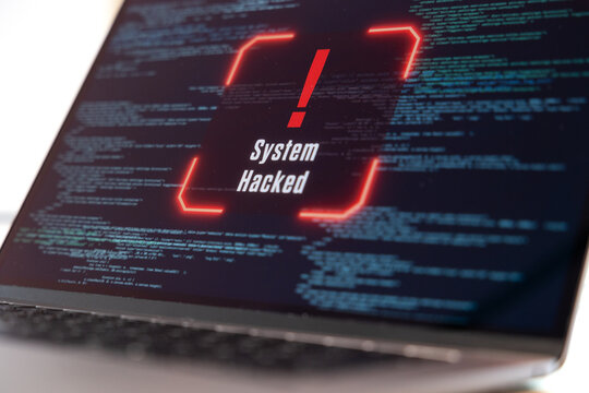 System hacked warning sign on a computer screen, data, code, encryption, computer crime. Data breach, spyware, hacker, communication problems, computer language, security, firewall.