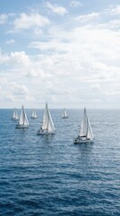 Fototapeta premium Sailboats in a regatta on the open sea