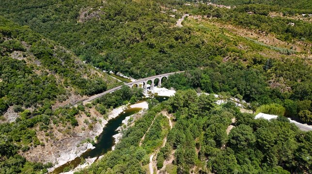 Aerial View of Historic Railway Bridge Crossing the Gardon River in Anduze, France