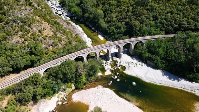 Aerial View of Historic Railway Bridge Crossing the Gardon River in Anduze, France