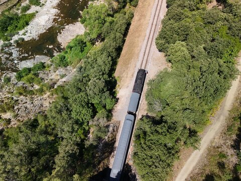 Aerial View of Historic Steam Train Through the C&eacute;vennes Forest near Anduze, France
