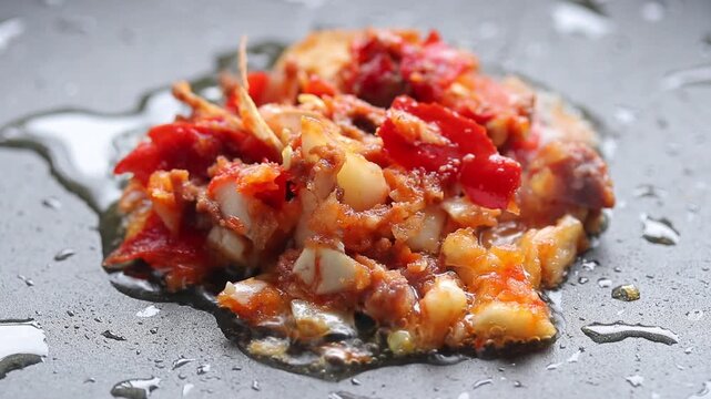 Crushed red chili and garlic in a hot pan, Thai food ingredients.