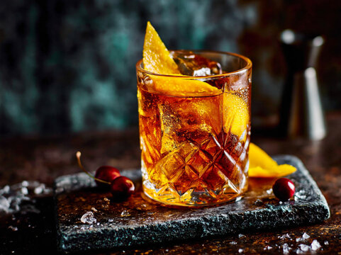 old fashioned cocktail with orange peel garnish
