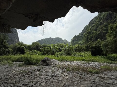 Cave opening tropical mountain landscape view