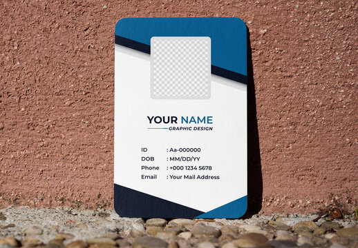 Mockup of A blank business card sits on a stone surface near a textured wall