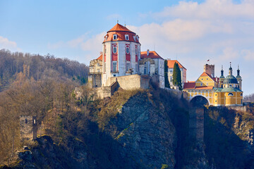 Majestic vranov castle on rocky cliff overlooking forest in spring with blue sky © Iurii Gagarin