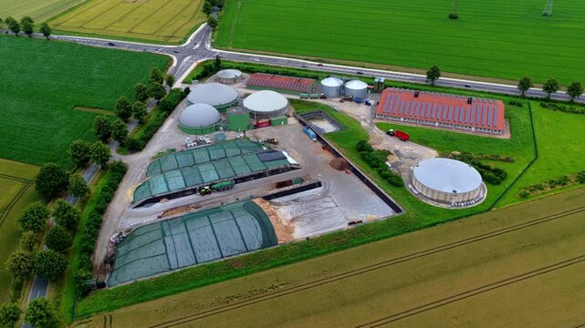 Zoom-Out Aerial Video of Biogas Plant, Wind Power and Farmland