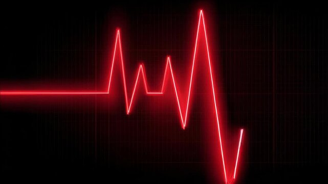 Emergency medical equipment showing heartbeat with red line on screen.