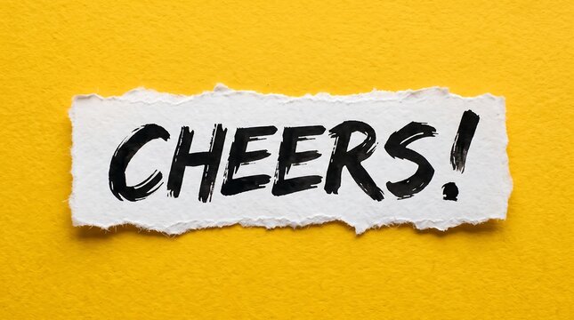 Handwritten "CHEERS!" in black ink on a torn white paper strip, set against a bold, vibrant yellow background, perfect for celebrations, toasts, and expressive design projects.
