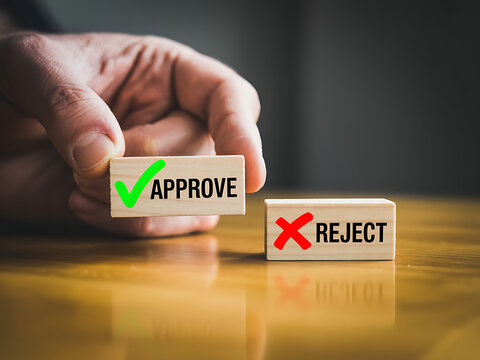 Wooden blocks show approve reject