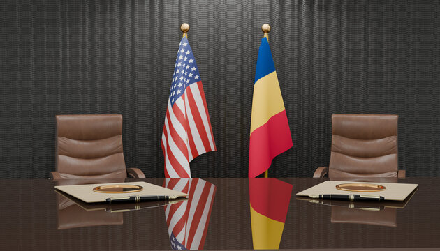 Diplomatic Summit: Two national flags stand proudly on either side of a polished conference table, symbolizing a significant international meeting between two countries.
