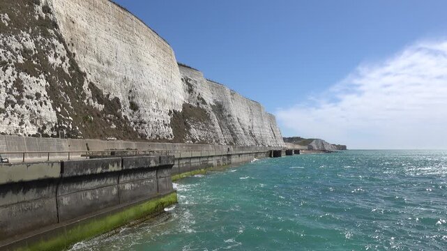 Undercliff promenade between Brighton and Rottingdean in East Sussex, England. With gentle wave movement on sea.