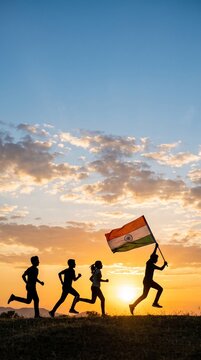 A silhouette of youth running with a waving tricolor flag against sunset sky for Independence Day freedom and optimism celebration