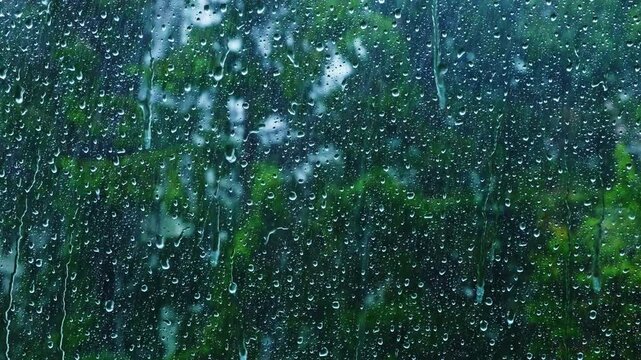 heavy rain falling on the window surface .stormy weather