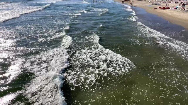 Tuscany coast panoramic view coastline with beautiful sand beaches at sunny day, Lido di Camaiore, Lucca, Italy.