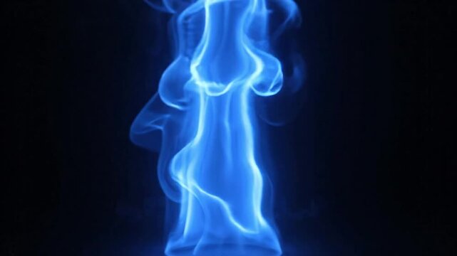 Vibrant Blue Fire Flame Flickering and Burning Intensively Against Isolated Dark Black Background