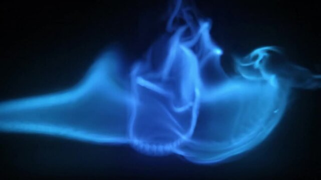Cinematic Abstract Blue Fire Flame Motion with Ethereal Smoke Effect Isolated on Black Background