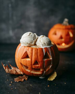 Festive halloween pumpkin ice cream dessert spooky jack o' lantern treat for autumn celebrations