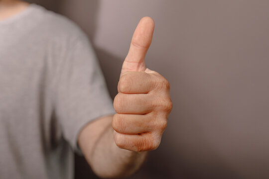 A clear hand gesture signaling agreement and satisfaction with an excellent approval.