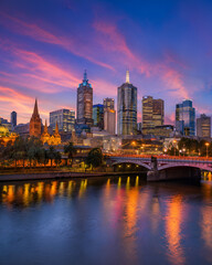 Fototapeta premium City Skyline at Dusk Reflected in River