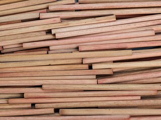 Obraz premium Densely layered natural wood sticks create a unique and messy organic linear pattern full of rustic texture. For Industrial background