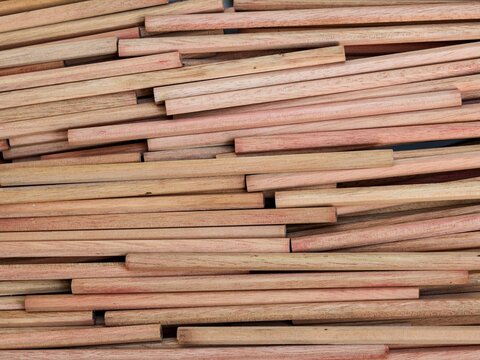 Densely layered natural wood sticks create a unique and messy organic linear pattern full of rustic texture. For Industrial background