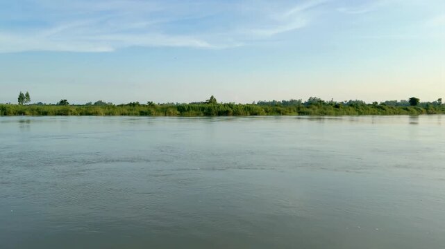 Wide panoramic shot of flowing calm river landscape under sky video