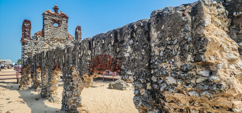 Side perspective of the ruined St. Antony's Church, showcasing weathered coral stone arches and walls left standing after the devastating 1964 Rameswaram cyclone