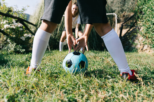 Two soccer players train on the sports field