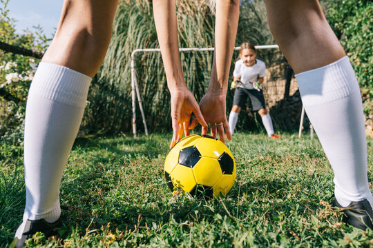 Two soccer players train on the sports field