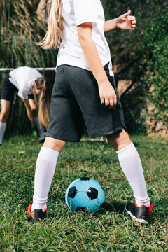 Two soccer players train on the sports field