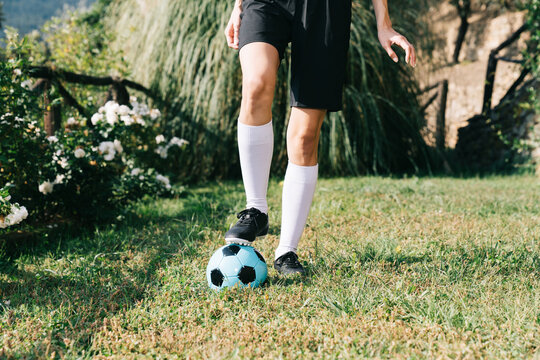 Female soccer player training with the ball