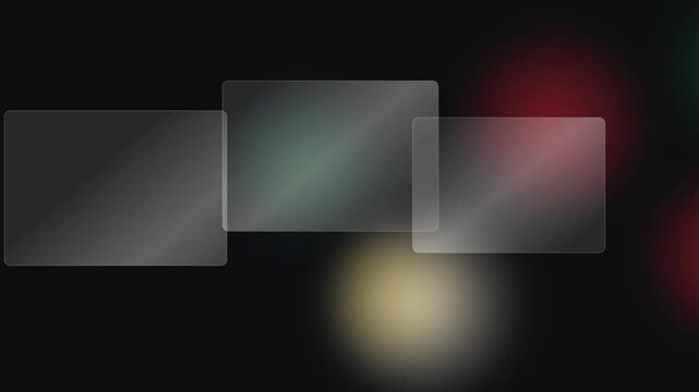 Modern transparent glass-like panels elegantly layered against a dark background with soft, out-of-focus lights, creating a sleek and abstract display