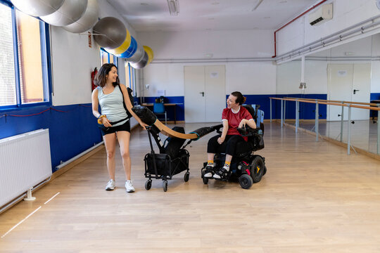 Two women arriving at rehabilitation center for physical therapy
