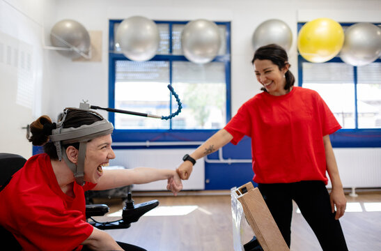 Woman with special needs enjoying occupational therapy session