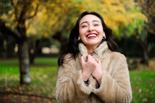 Smiling woman in autumn park