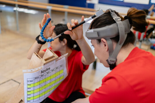 Woman wearing head device performing rehabilitation eye